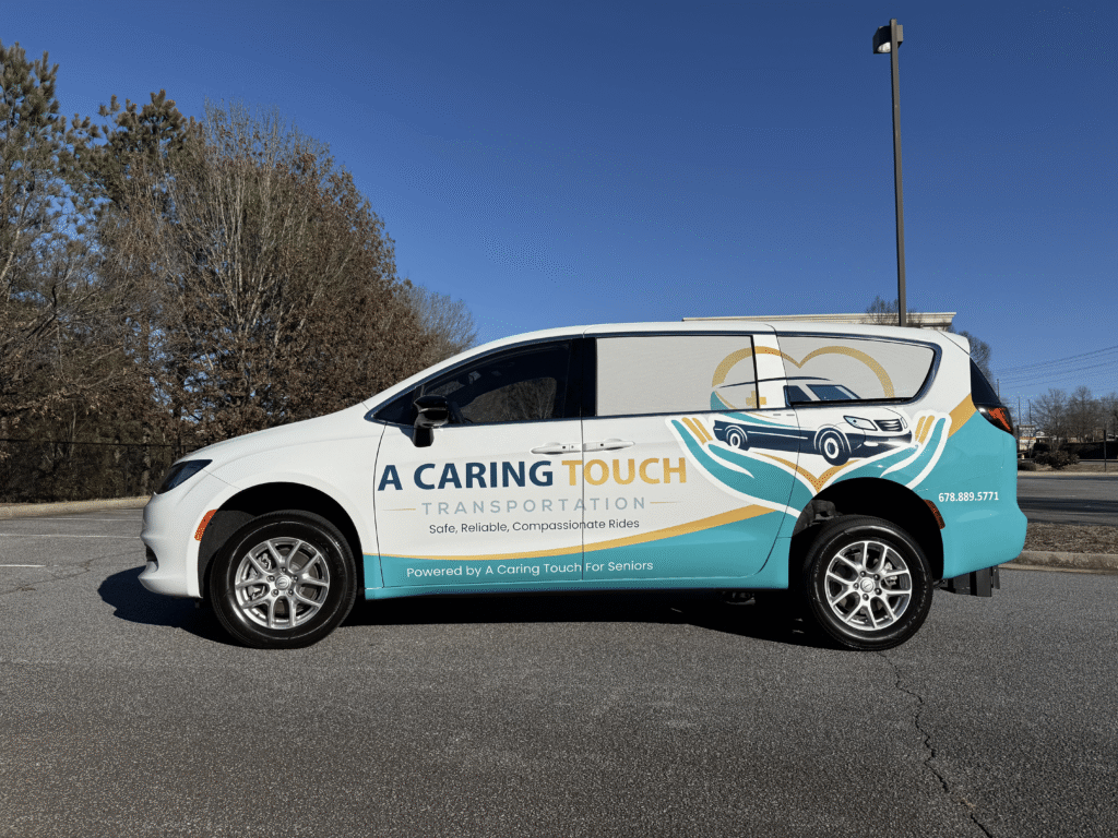 A Caring Touch Transportation branded van parked outdoors