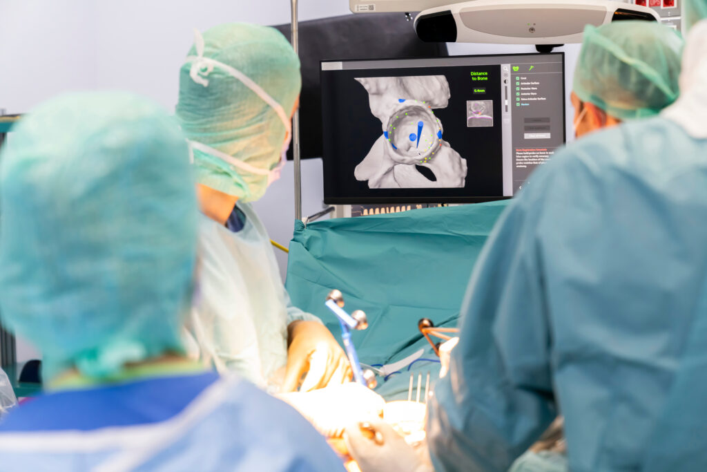 Surgical team performing a post-op procedure in an operating room